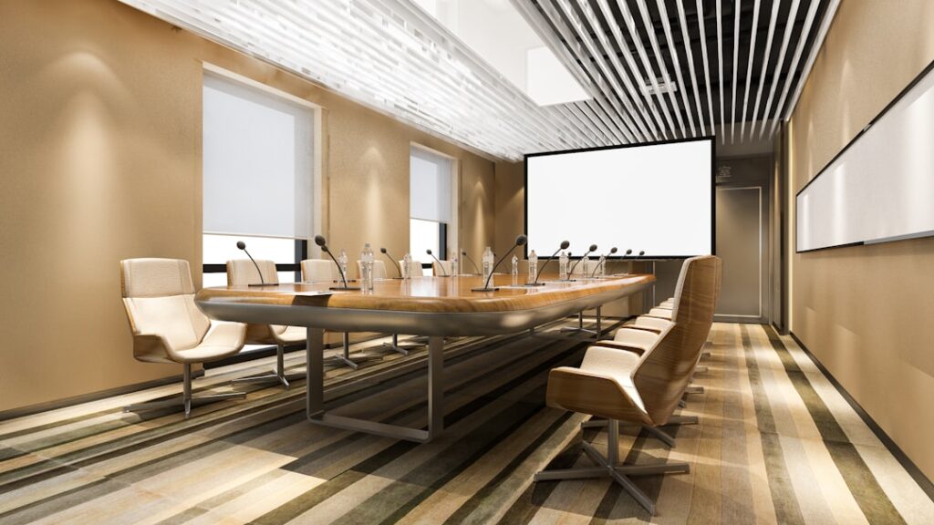 Professional sports management boardroom overlooking a modern stadium