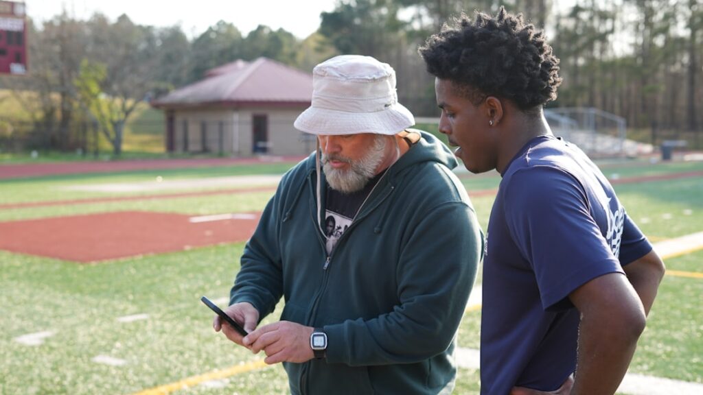 Sports performance analyst using AI technology to track athlete movement