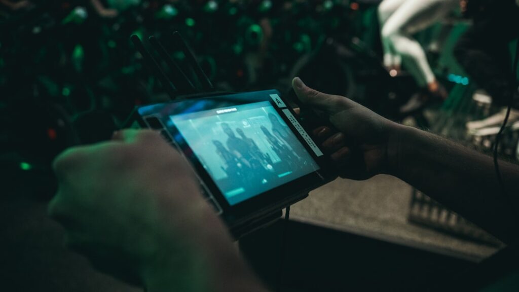 Sports scientist analyzing real-time biometric data from a wearable sensor in 2026