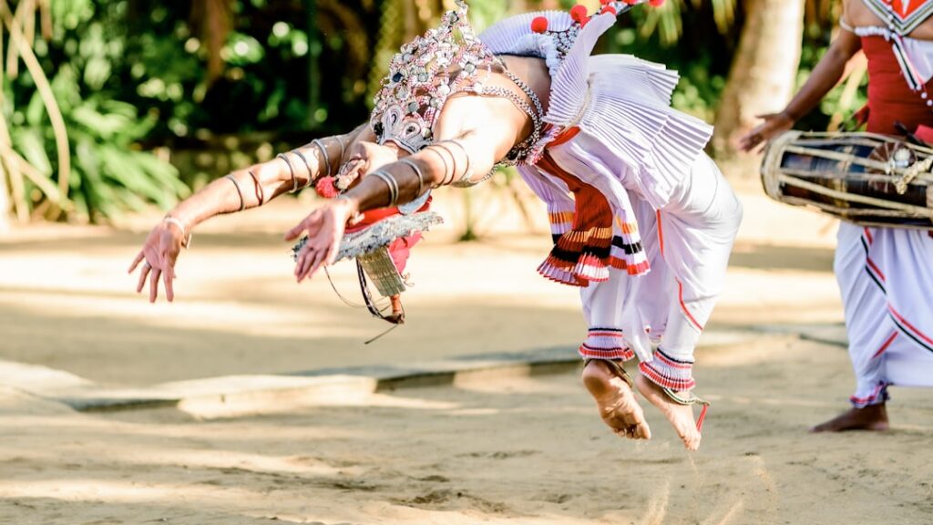 Athletes performing Mallakhamb at the Khelo India national sports event