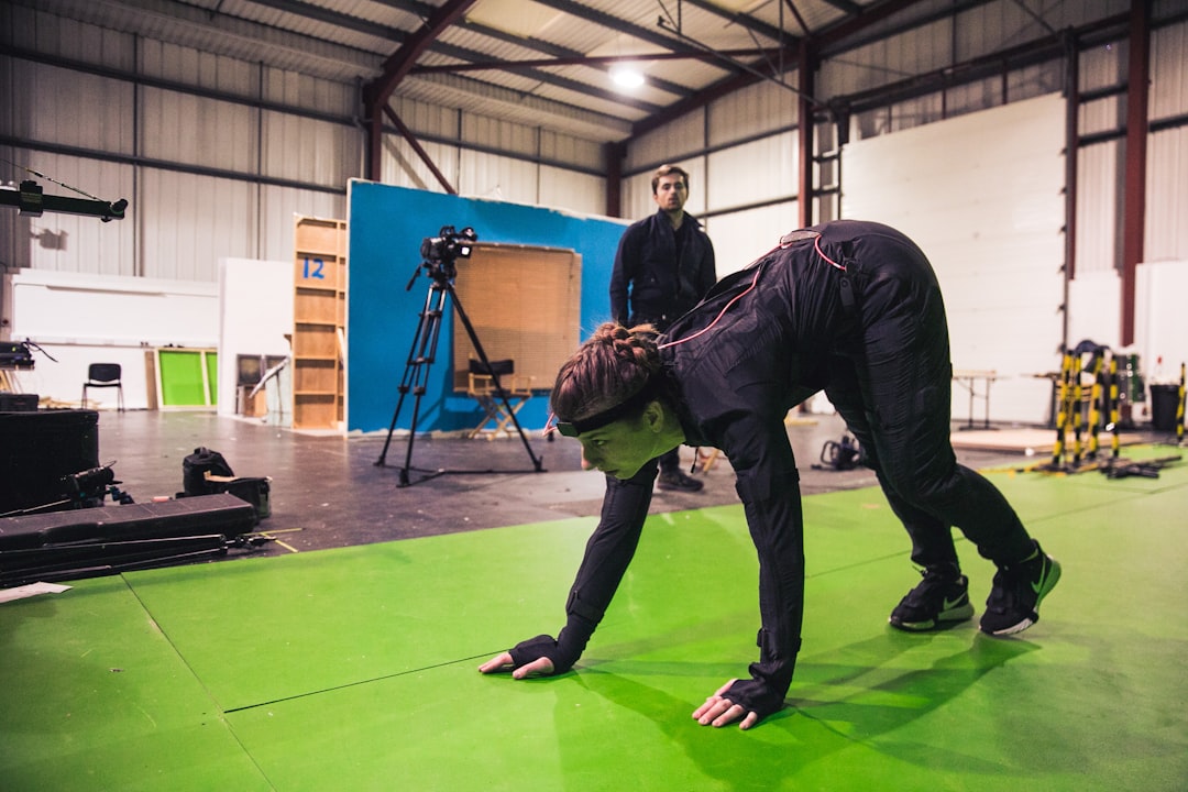 Professional kinesiologist using motion capture technology to analyze an athlete's gait