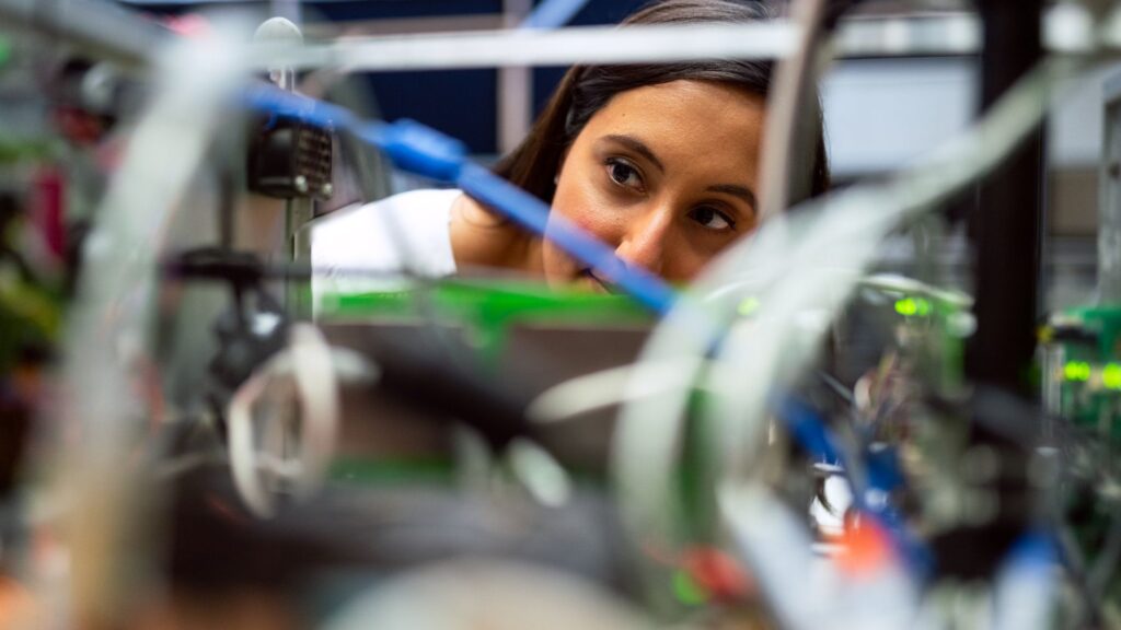 Sports science student in India analyzing athlete biomechanics in a high-performance lab