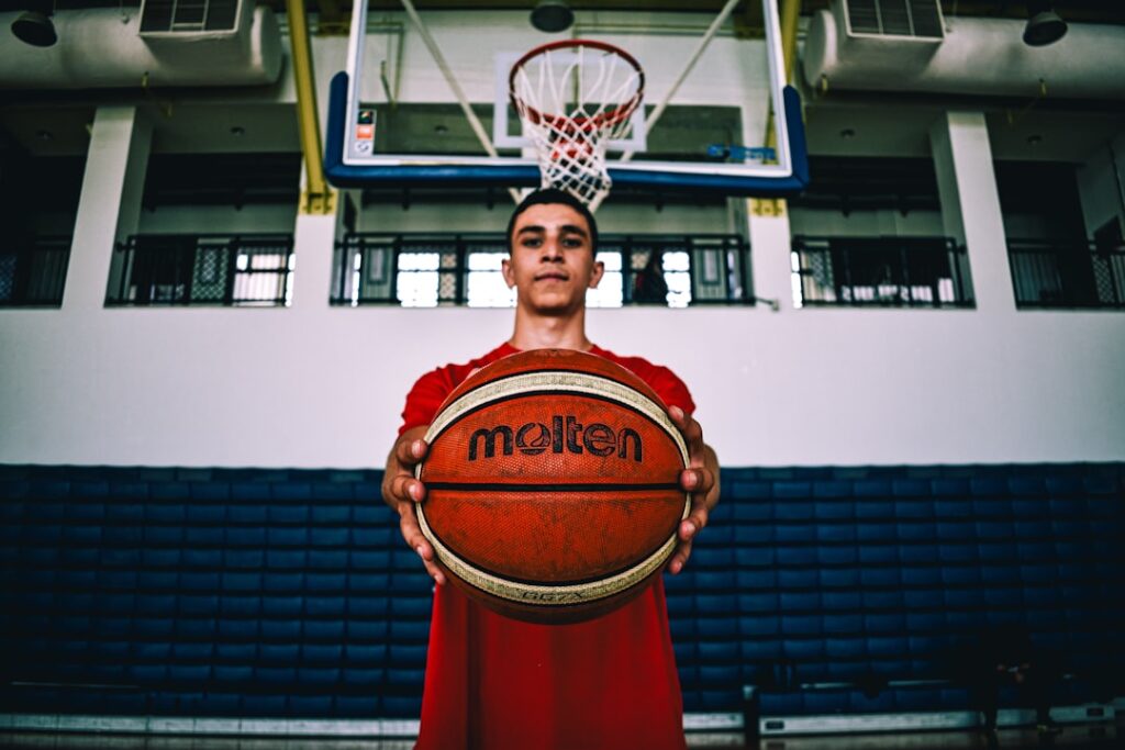 Sports management professional reviewing an athlete's brand and investment portfolio
