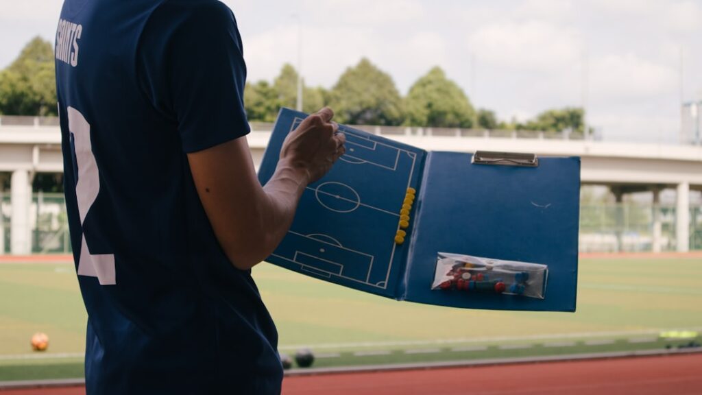 Sports performance analyst explaining data insights to a team coach